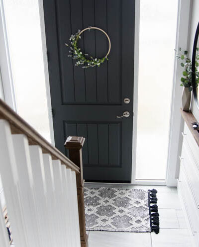 DIY Split Level Entry Makeover- I LOVE this entry. The oversize door, scandi influence and that shoe storage!