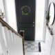 DIY Split Level Entry Makeover- I LOVE this entry. The oversize door, scandi influence and that shoe storage!