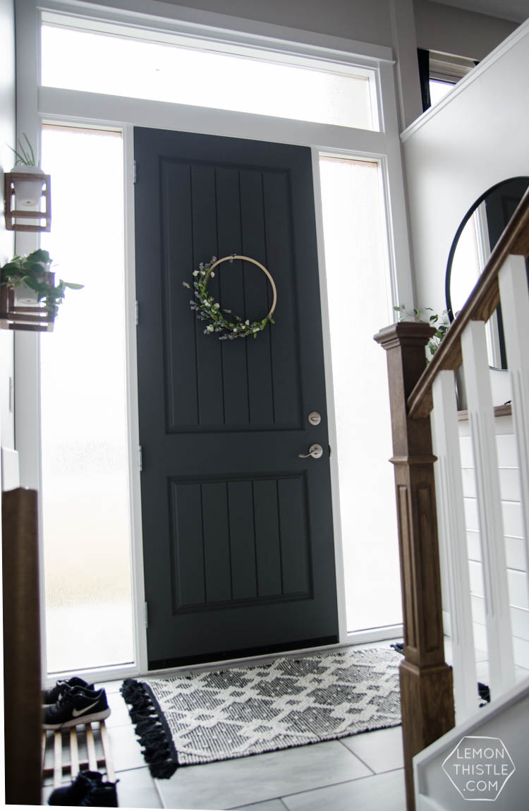 DIY Split Level Entry Makeover- I LOVE this entry. The oversize door, scandi influence and that shoe storage!