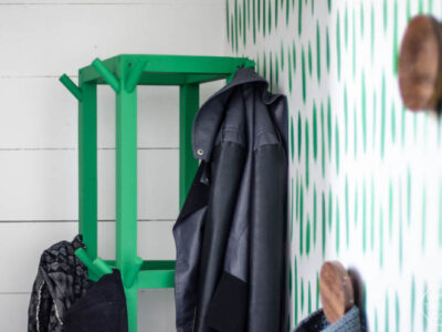 Simple Wooden DIY Coat Rack- love the bright green of this one! So great for a small space.
