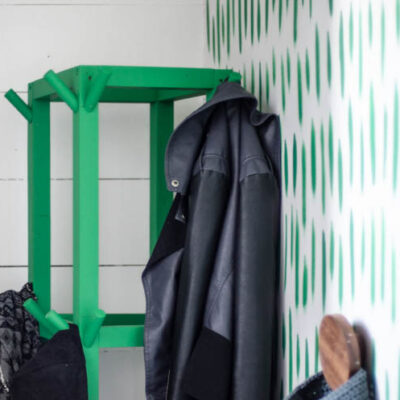 Simple Wooden DIY Coat Rack- love the bright green of this one! So great for a small space.