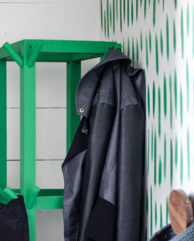 Simple Wooden DIY Coat Rack- love the bright green of this one! So great for a small space.