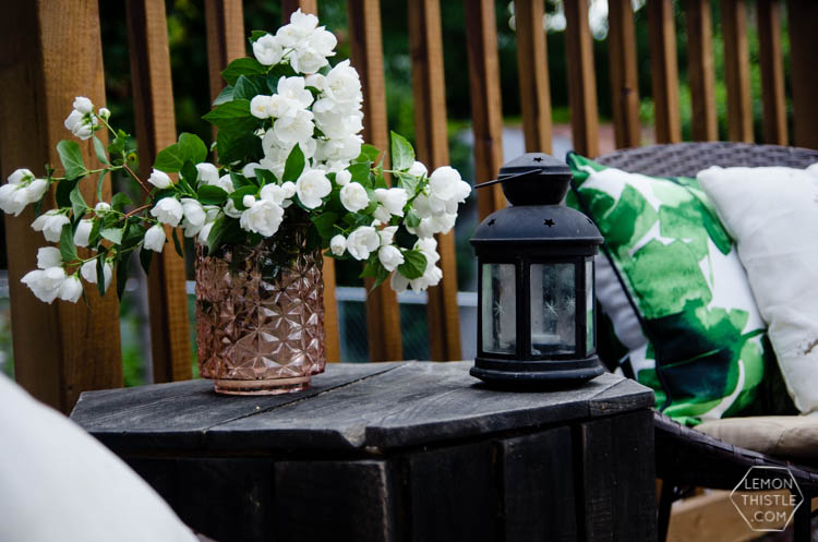 I love the wood look deck and this seating area is so sweet!