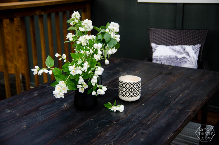 I love the wood look deck and this seating area is so sweet!