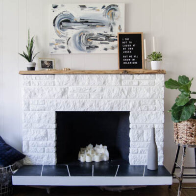 DIY Fireplace Refresh with painted stone & live edge mantle- great tips on how to!