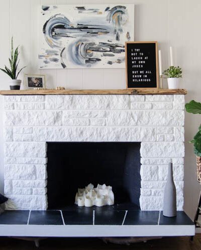 DIY Fireplace Refresh with painted stone & live edge mantle- great tips on how to!
