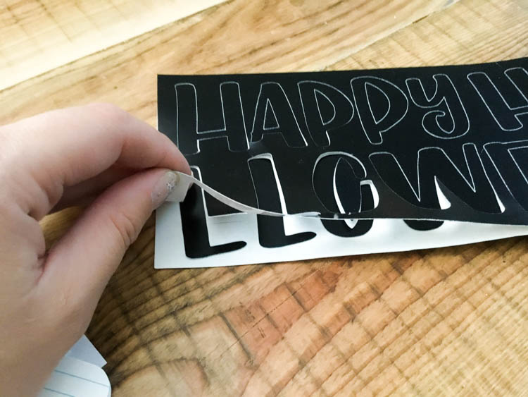 DIY Copper Foiled Halloween Garland - such a cute bunting and love how shiny that handlettered foil is!