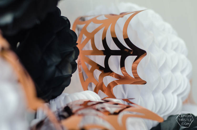 Giant DIY Halloween Party Garland with tissue honeycomb balls and party foil