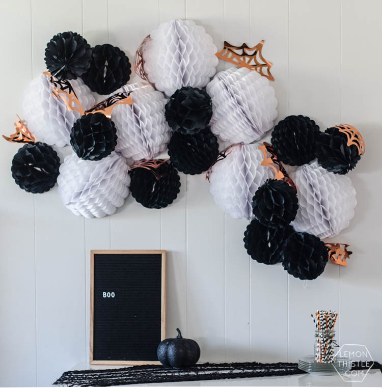 Giant DIY Halloween Party Garland with tissue honeycomb balls and party foil