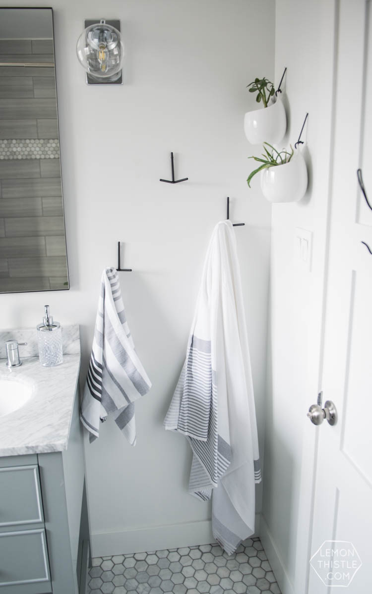 Classic Bathroom Makeover with marble hexagon tile and Modern Details- love the matte black with the chrome!