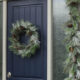 A modern holiday entry way- love the frosted greens and simple black planter- perfect for christmas