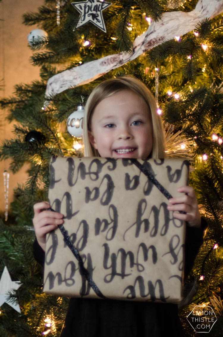 This handlettered Kraft wrapping paper is amazing! Now I want that brush so I can make some to wrap my christmas gifts