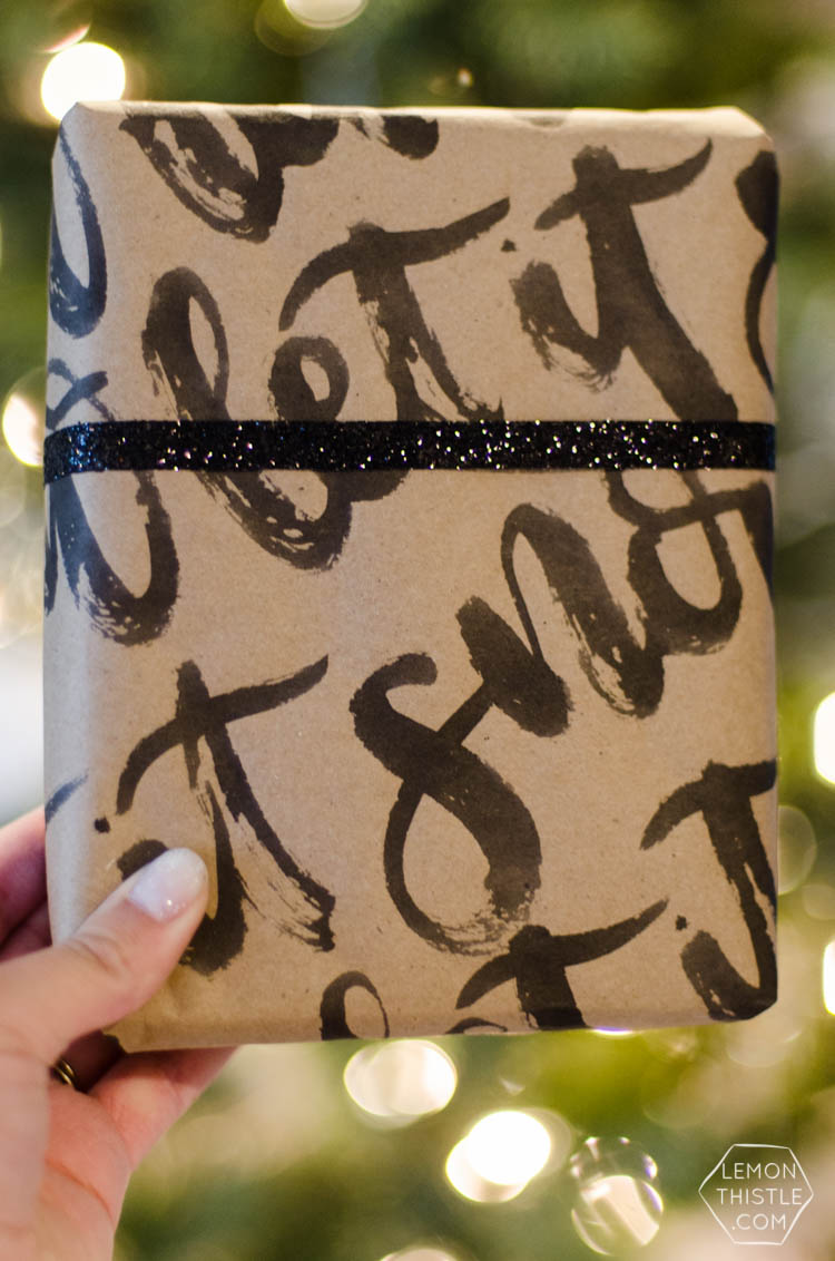 This handlettered Kraft wrapping paper is amazing! Now I want that brush so I can make some to wrap my christmas gifts
