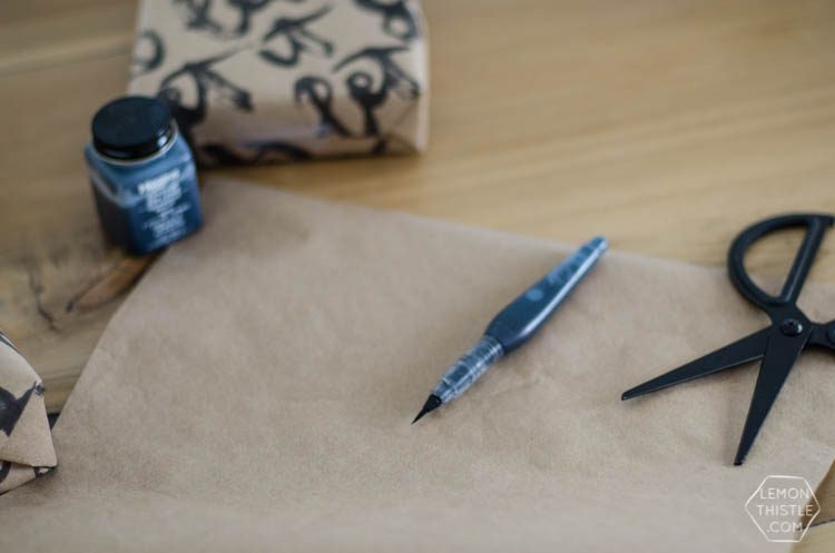 This handlettered Kraft wrapping paper is amazing! Now I want that brush so I can make some to wrap my christmas gifts