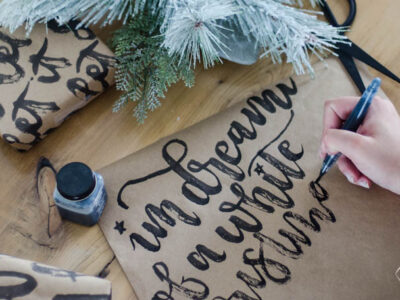 This handlettered Kraft wrapping paper is amazing! Now I want that brush so I can make some to wrap my christmas gifts