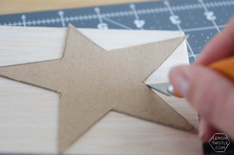 DIY Paint Dipped Wooden Star Place Cards- love that you don't need any tools to cut these wood stars! Such beautiful place settings that can be taken home as gifts after the dinner party