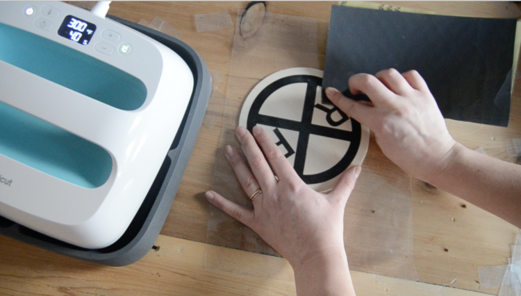 sanding iron on vinyl on wood for a distressed finish