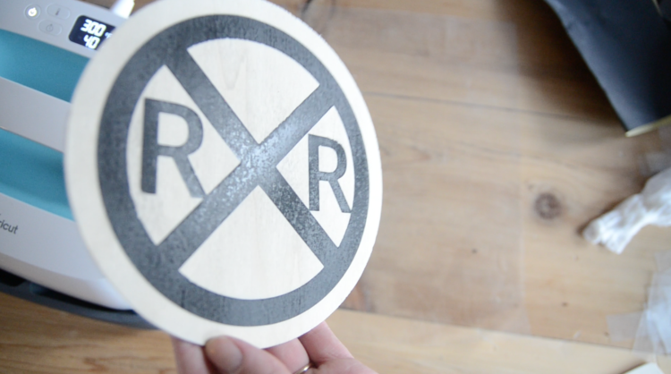 showing the distressed finish of sanding iron on vinyl on wood