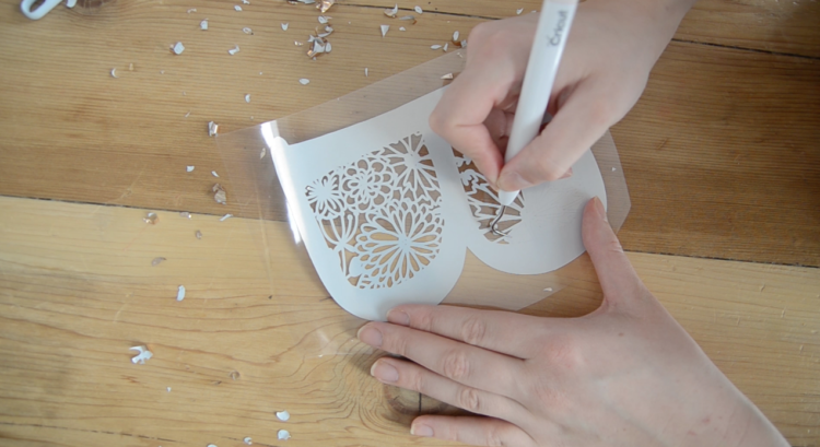 weeding floral b monogra out of foil iron on material for cricut