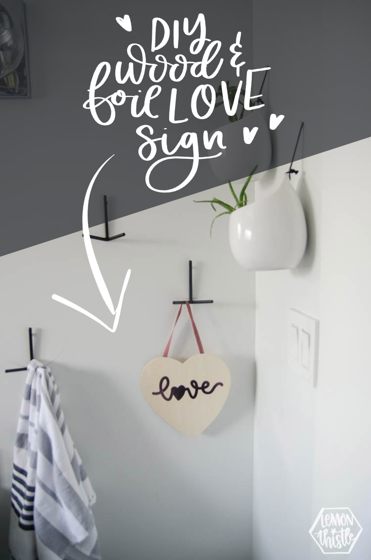 Photo of wooden heart sign with script word love in pink foil. Text ovelay: DIY Wood & Foil Love Sign