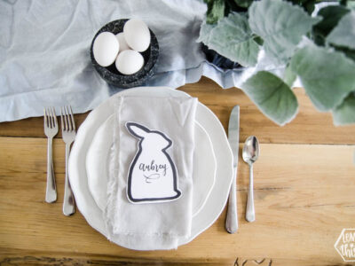 Easter bunny shaped black and white place card at natural pastel easter place setting