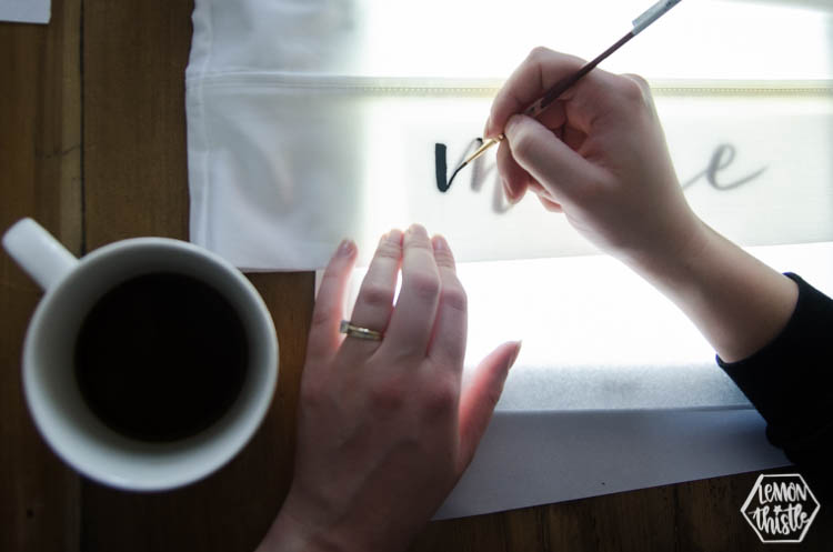 Using a lightbox to letter mine and yours on pillow cases with paint