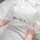 Putting on a king size pillow cover with the lettering 'mine'