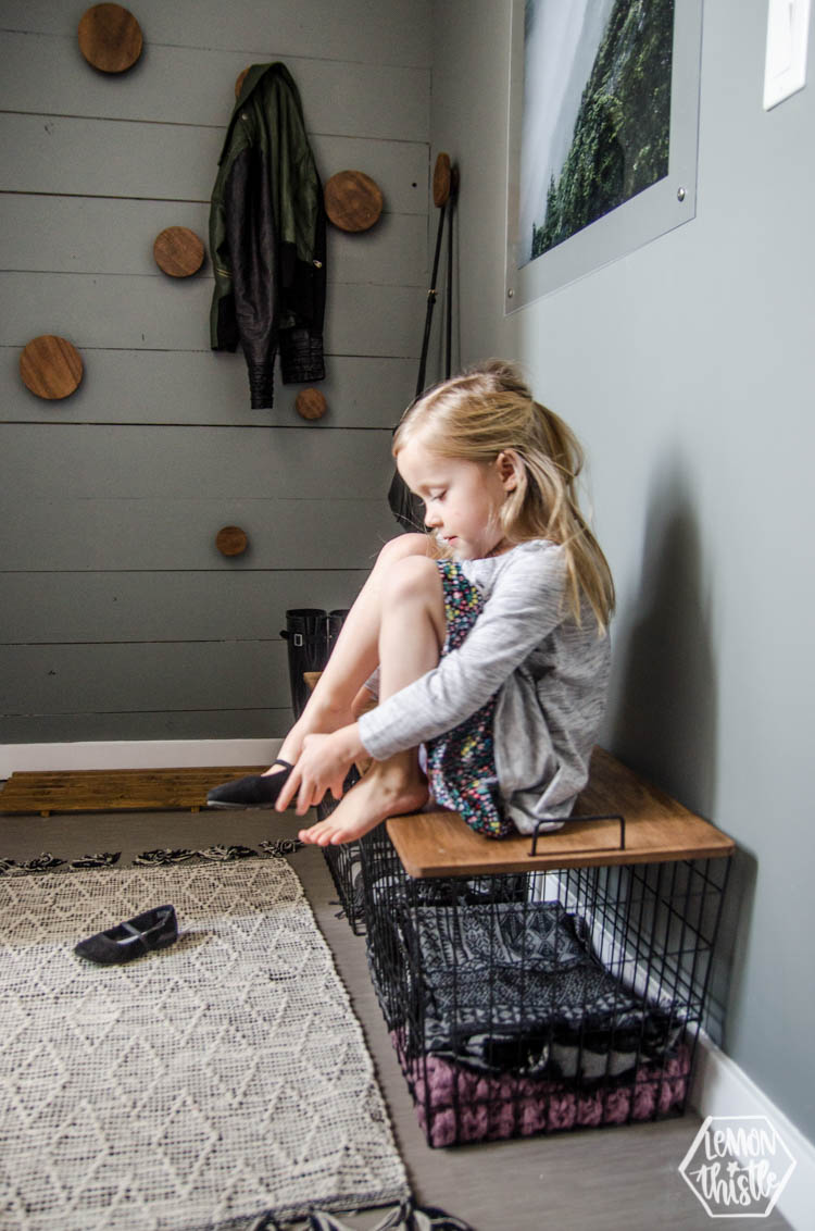 modern grey and wood DIY Mini Mudroom Makeover- showing how basket lids remove for storage, but on they are a bench for kids