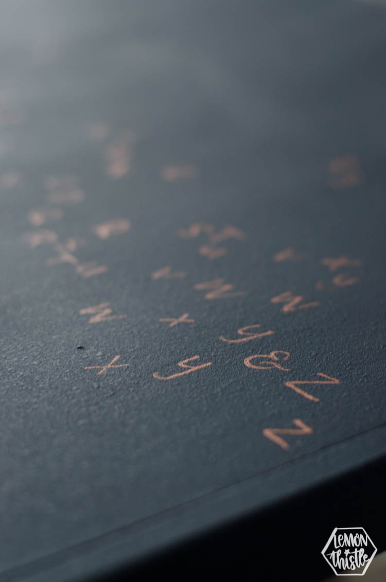 Copper alphabet on kids play table