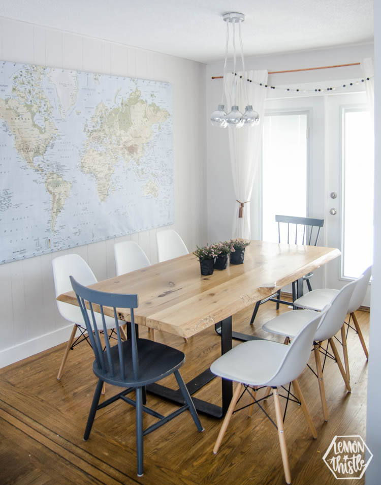 modern dining room with live edge table and potted plants as a spring centerpiece