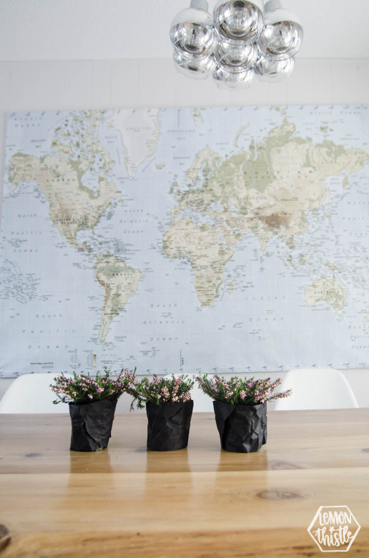 potted plants as a spring centrepiece wrapped in matte black paper