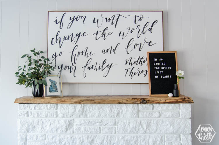 spring mantel decor with brush lettered painting above, vase of eucalyptus and letterboard