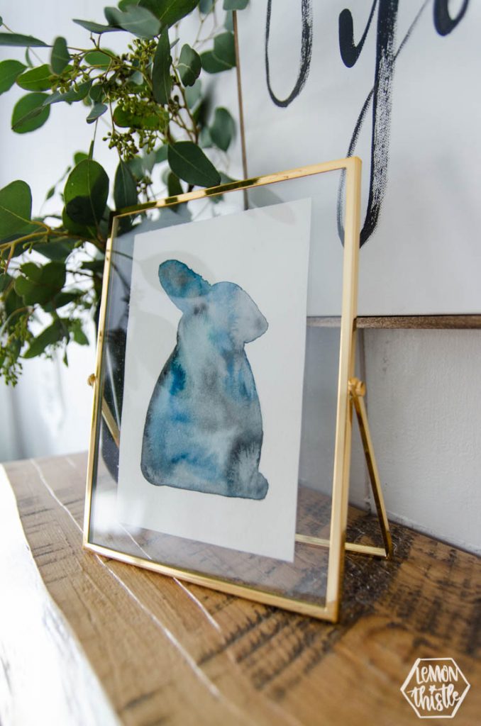 Side view of DIY modern watercolour bunny for easter in moody blues