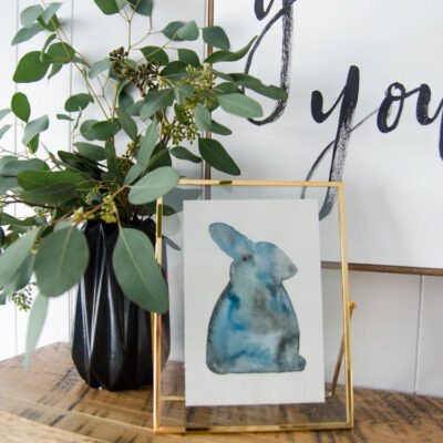 Watercolour rabbit with vase of seeded eucalyptus for spring mantel decor