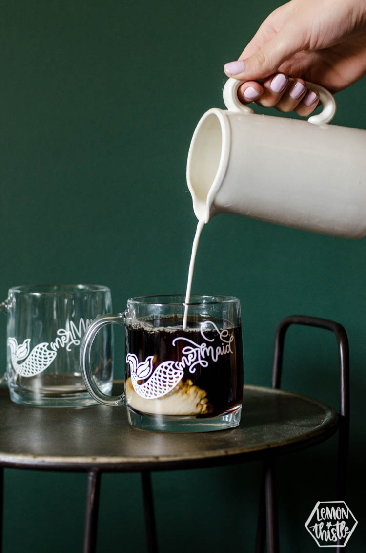 Pouring cream into coffee in clear glass DIY Mermaid Mug