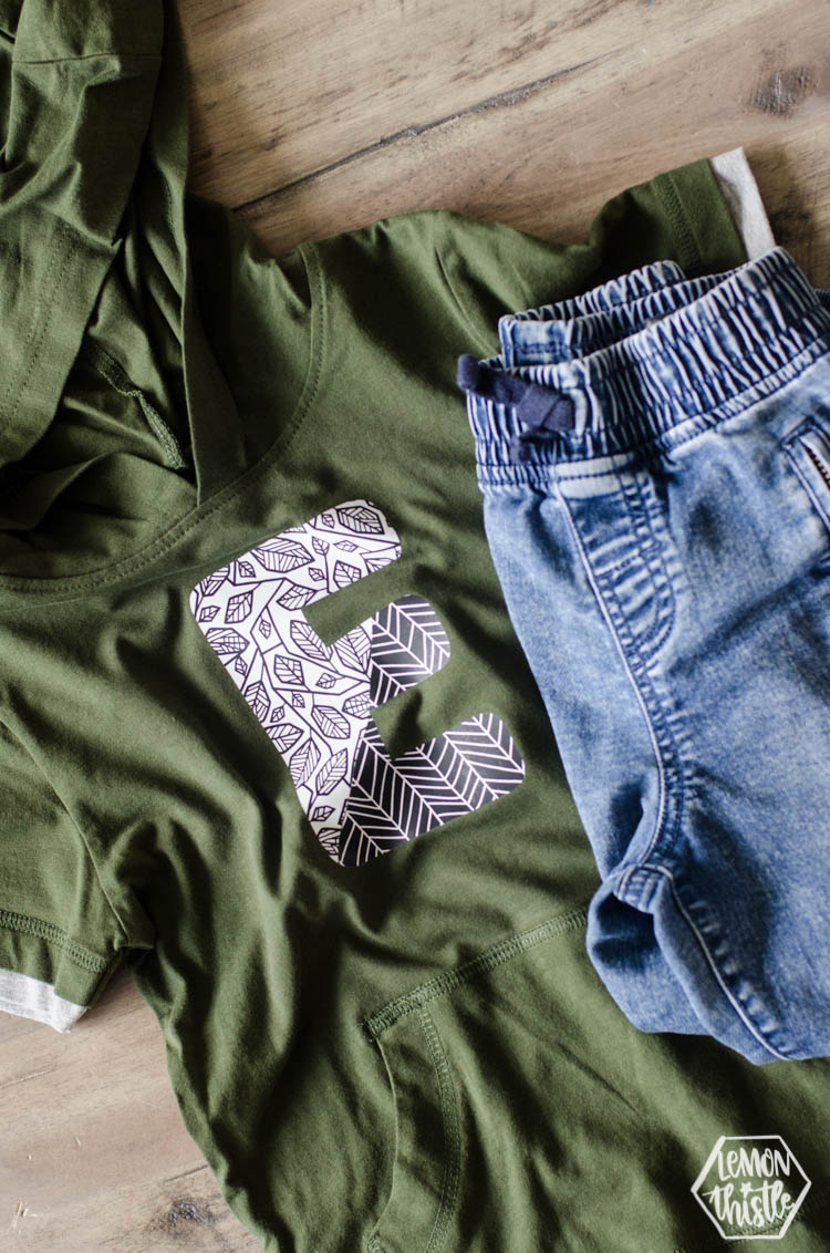 Pattered monogram shirt- using black and white patterned iron on over green shirt