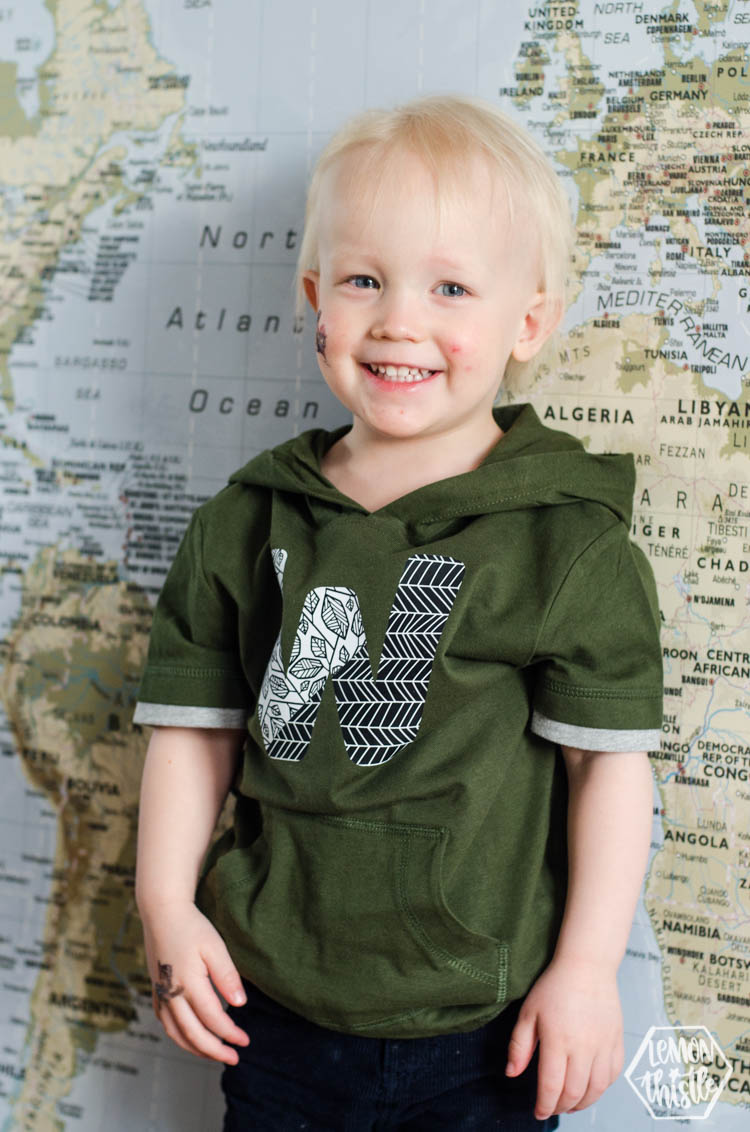 boy wearing patterned W tshirt
