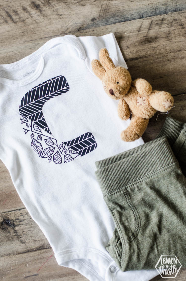 Onesie with large C in two designs of patterned iron on- simple cricut diy
