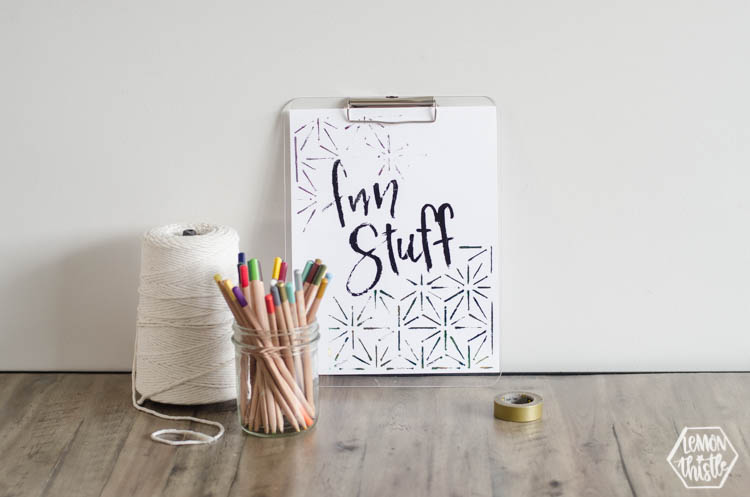 art station with macrame string, pencil crayons and clipboard with 'fun stuff' quote in black foil