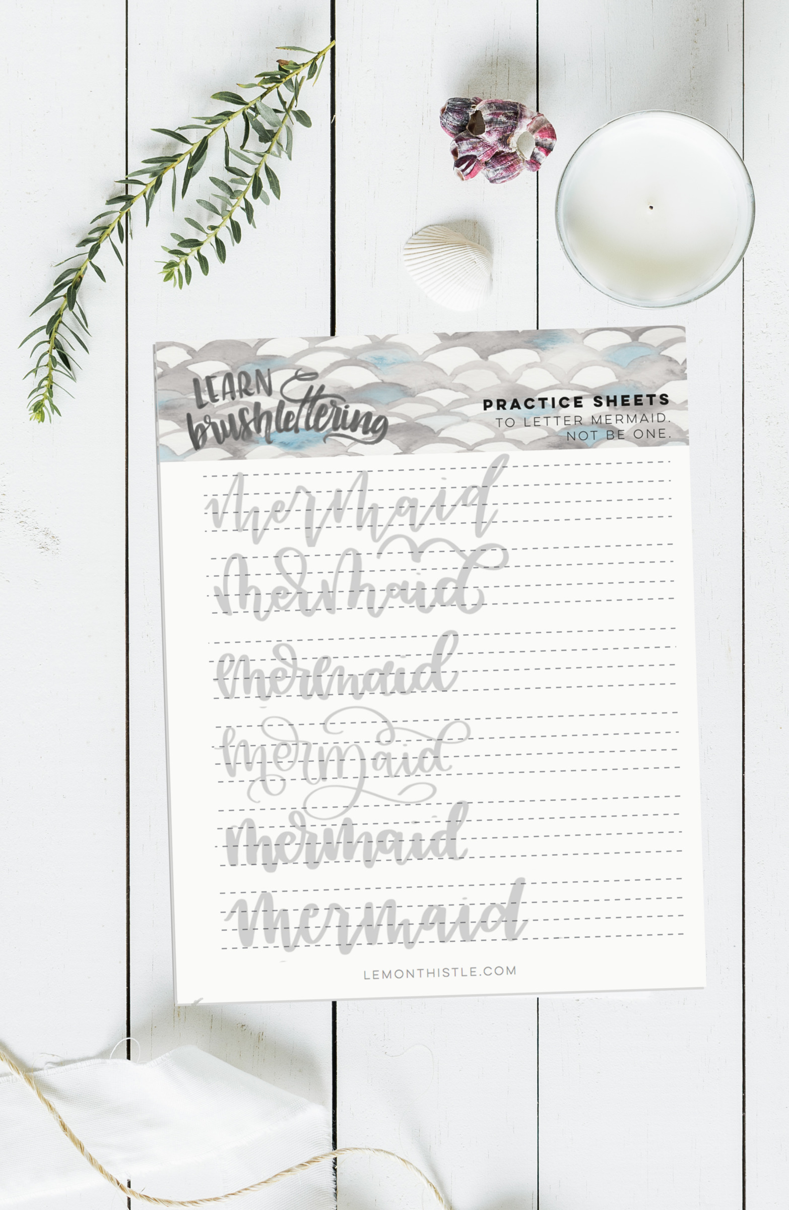 Free printable practice sheet for hand lettering 'mermaid'