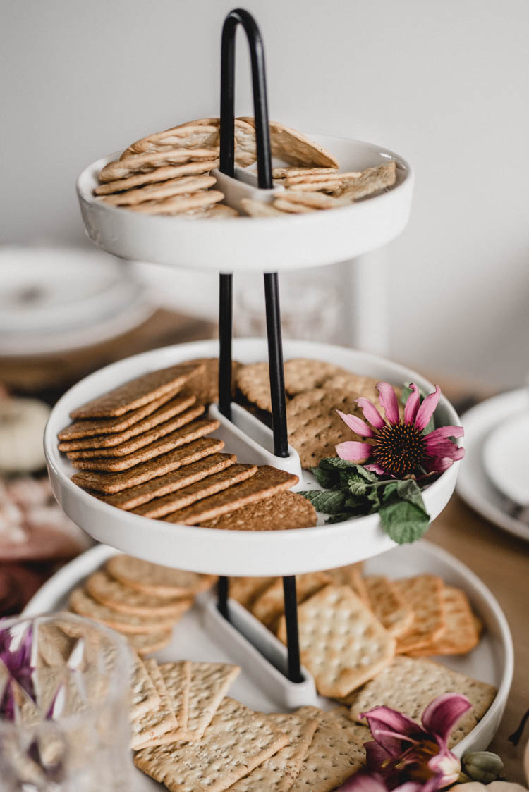Hairpin tiered serving tray with crackers and coneflower