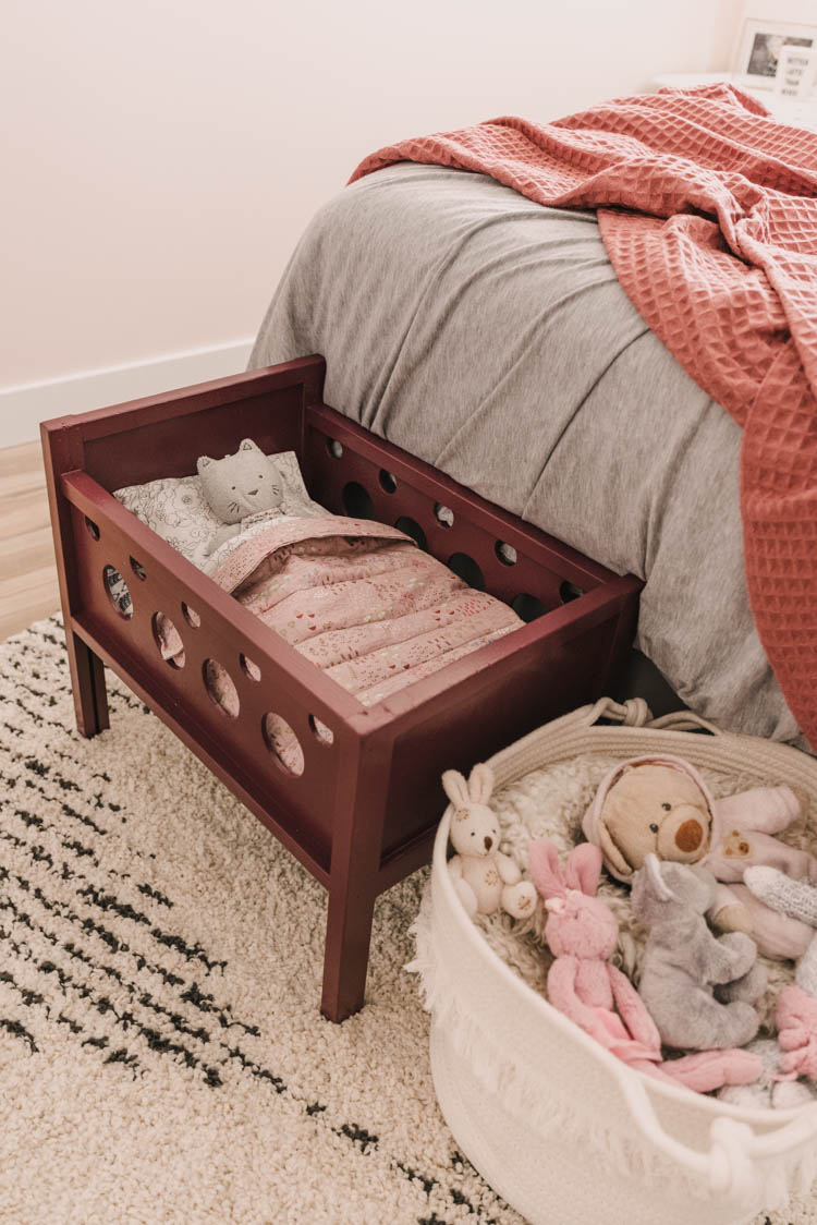 Refinished wood doll crib- love the modern sheet set!