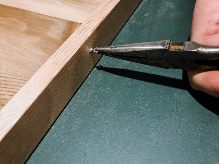 Eye hooks into wood frame