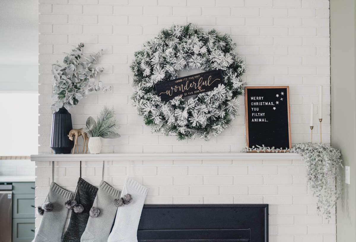  Modern holiday mantel with flocked greenery, black and white! And a letterboard ;)