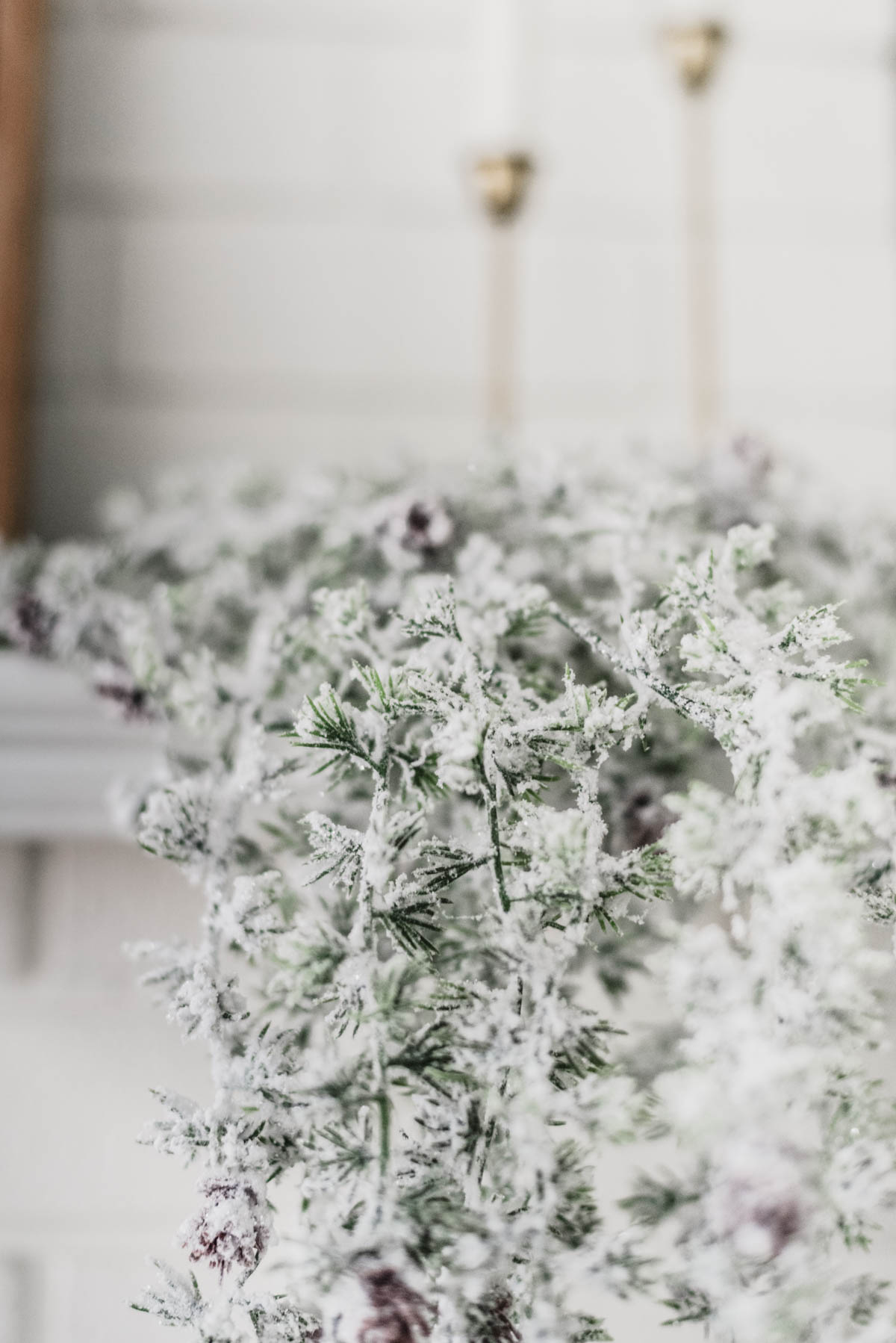 Modern holiday mantel with flocked greenery, black and white! And a letterboard ;)