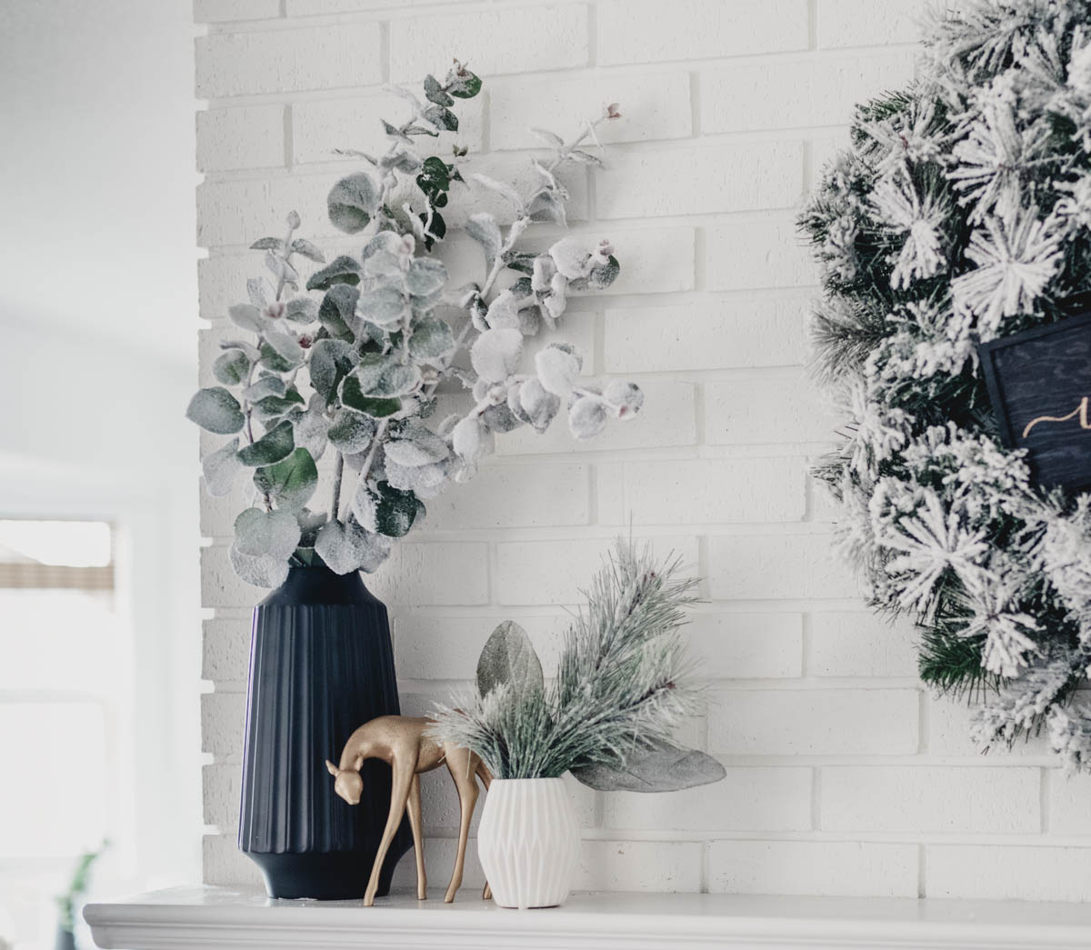 Modern holiday mantel with flocked greenery, black and white! And a letterboard ;)