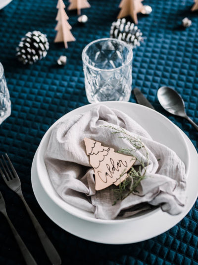 Cute little wooden place cards for a modern christmas table setting