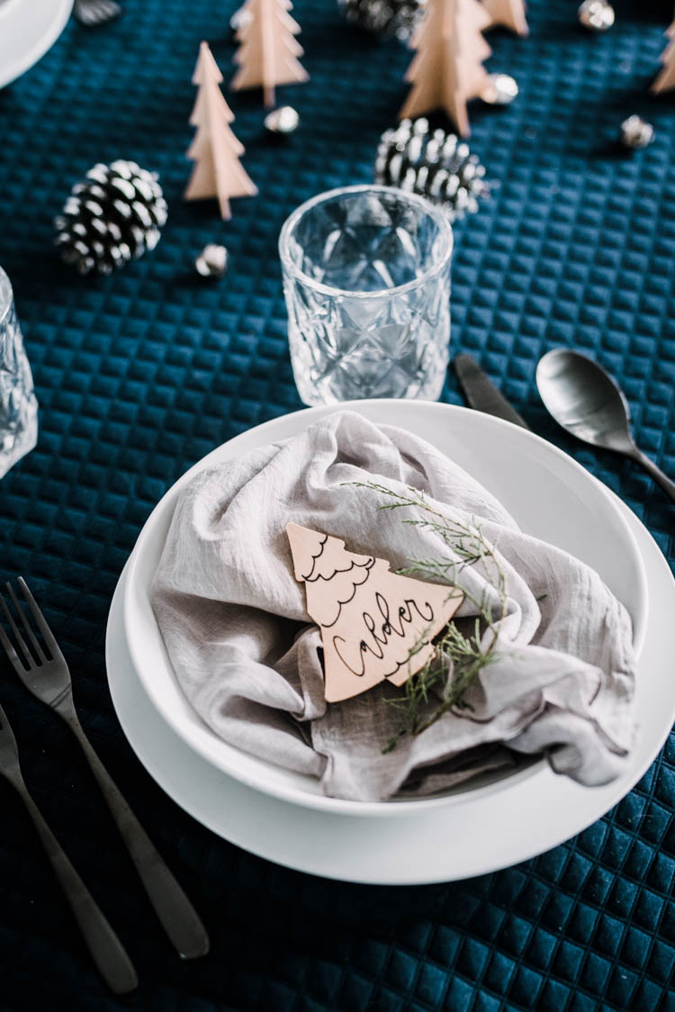 Cute little wooden place cards for a modern christmas table setting