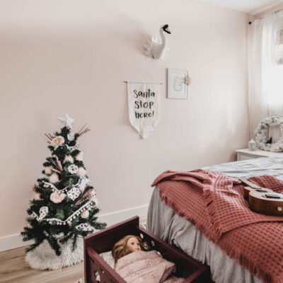 Cute little christmas tree in a girls bedroom