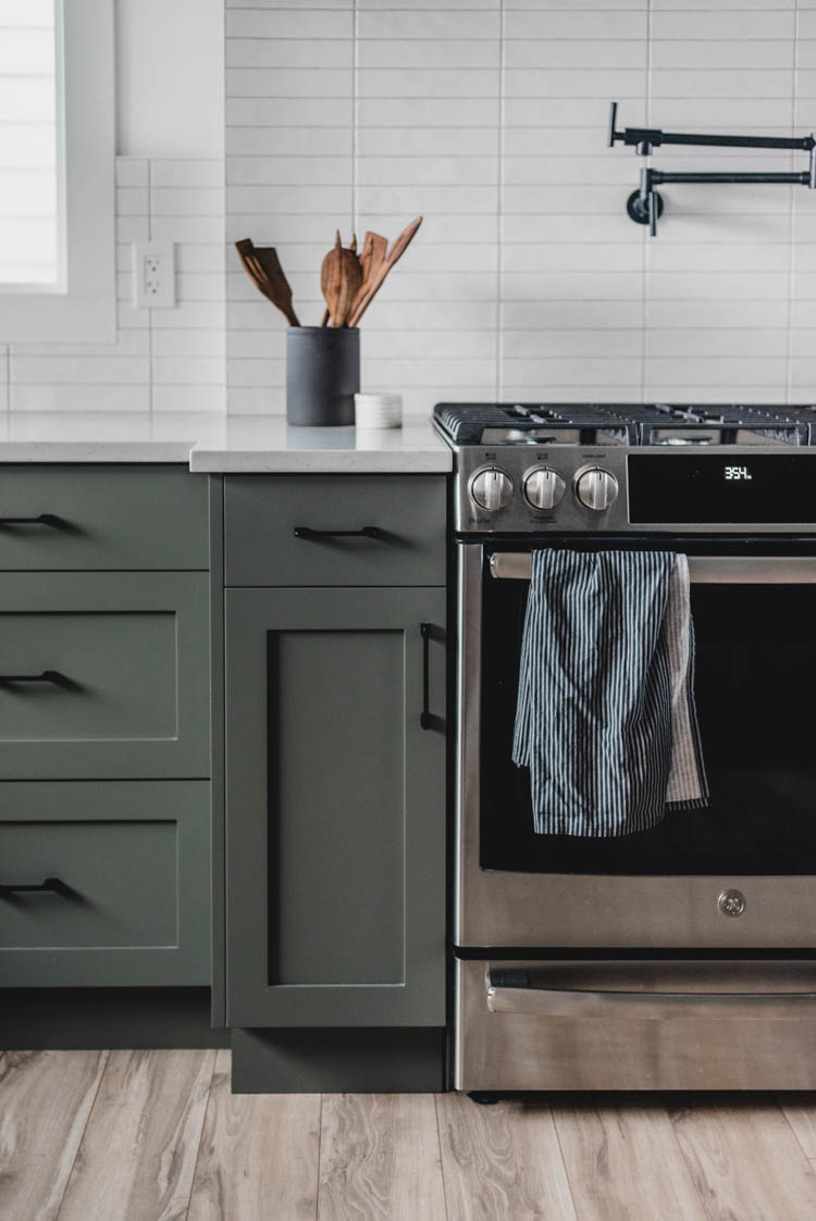 Love this range and green cabinet combo